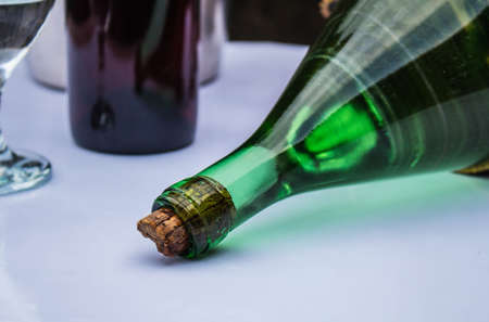 Laying bottle of wine on the table.の写真素材