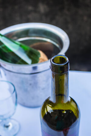 Opening a bottle of wine at a party.の写真素材