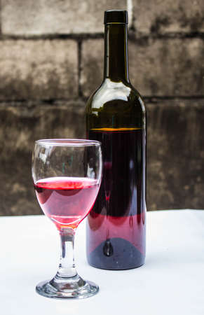 Drink a glass of red wine at a party.の写真素材