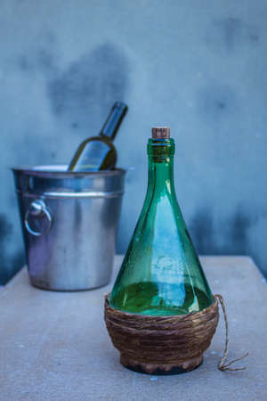 Wine is the drink down on the table.の写真素材