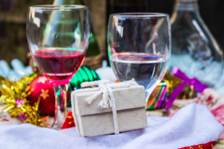 Gift box and glass of drink in festival