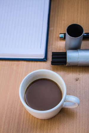 Afternoon coffee on the deskの写真素材