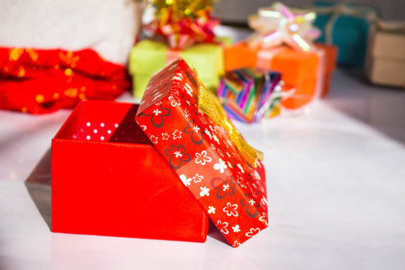 Red gift box with the lid on.
