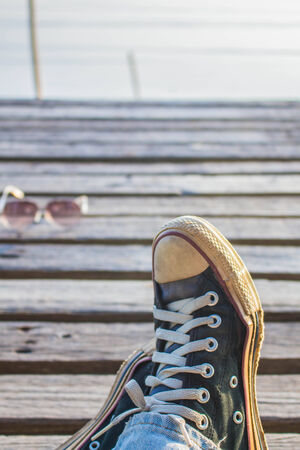 Wear sneakers and wooden floors.の写真素材