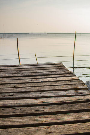 Wooden resting grounds extending to the sea.の写真素材