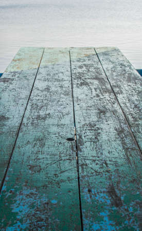 Wooden floor overlooking the sea.の写真素材