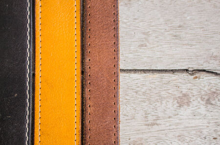 Leather belt arranged on the floor.の写真素材