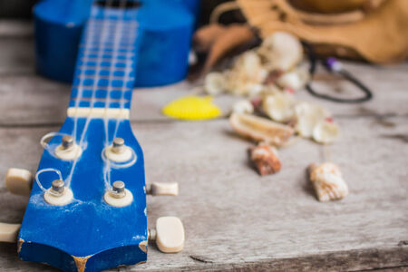 Ukulele and fabrics that are placed on the table.の写真素材