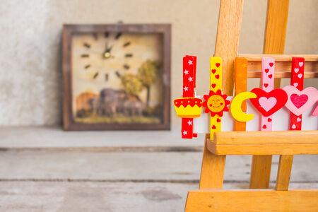 Multi colored wooden clamps on the cradle drawing.の写真素材
