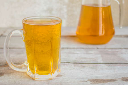 Beer glass on the wooden floorの写真素材