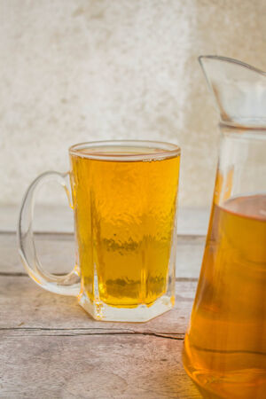 Beer is placed behind the pitcher.の写真素材