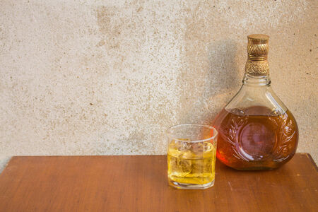 bottle of whiskey on the tableの写真素材