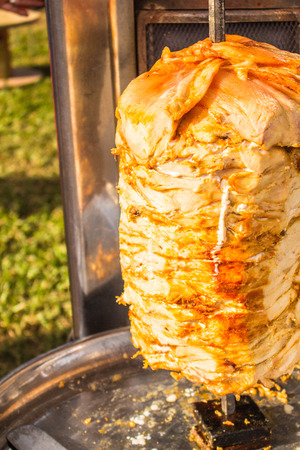 The chicken is roasted on an open fireの写真素材