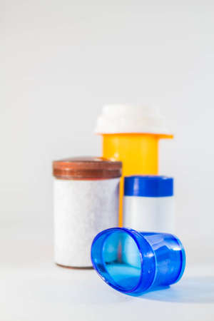 Measuring and medicine bottle on the floor.の写真素材