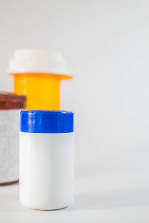 Medicine Bottle sizes placed together on the floor.の写真素材