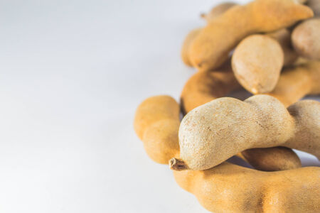 Ripe tamarind put together on the floor.の写真素材