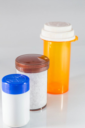 Brown medicine bottle placed in the middle.の写真素材