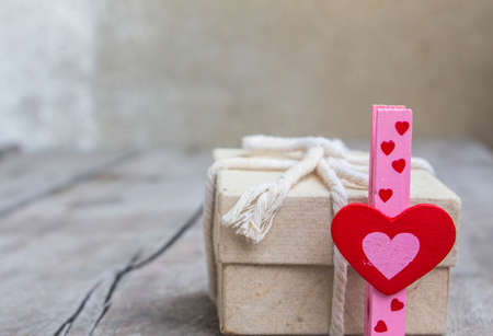 Red heart symbol and loving gift.