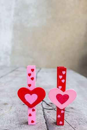 Colorful hearts put together on a wooden floor.の写真素材