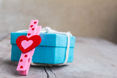 Red heart and gift boxes on a wooden floorの写真素材