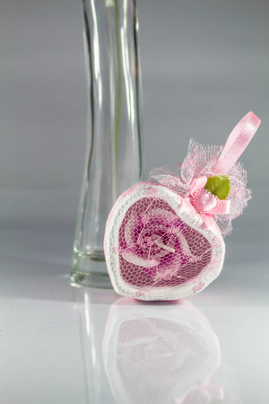 Souvenirs pink and bottle on the floor.の写真素材