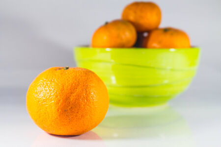 Tangerine is placed on the ground.の写真素材