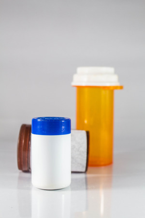 Bottles of various sizes on background.の写真素材