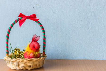 Rabbit in the gift basket on the table.の写真素材