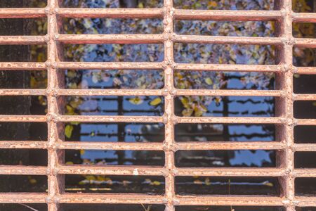 Steel grating cover off the old pipe.の写真素材