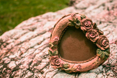 Antique frame on a rock.の写真素材
