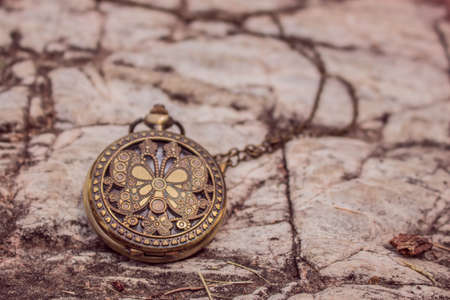 Classic clock on rock backgroundの写真素材