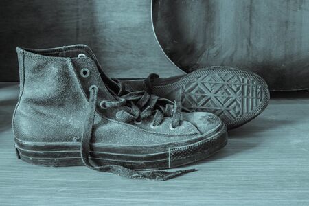 Old sneakers with black and white images.の写真素材