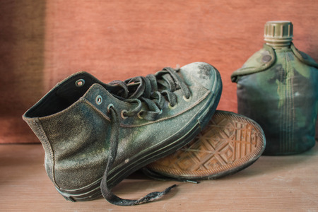sneakers on the wooden of the vintage.の写真素材