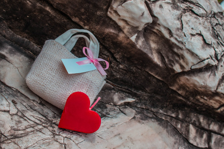 Heart and gift on background as a rock.の写真素材
