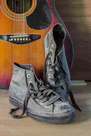 Vintage old shoes on a wooden floor.の写真素材