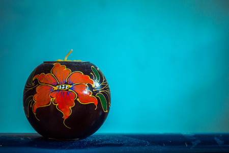 Candle on a blue background.の写真素材