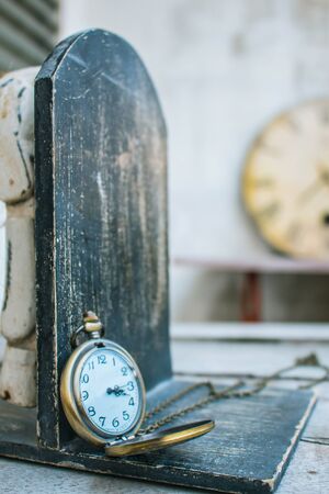 Classic antique clock on wood.の写真素材