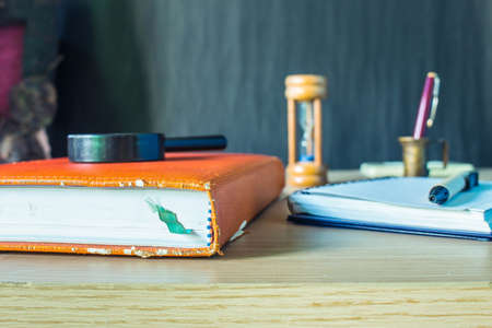 Books and stationery on the desk.の写真素材