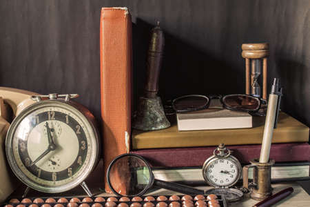 Supplies and stationery old on desk in the roomの写真素材
