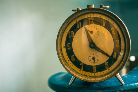 Old antique clock on the background of vintage.の写真素材