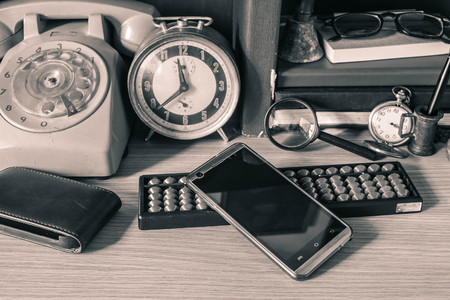 Mobile phones and devices on the desk.の写真素材