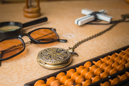 Stopwatch and supplies on the table.の写真素材