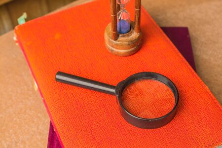 Magnifying glass on a bookの写真素材