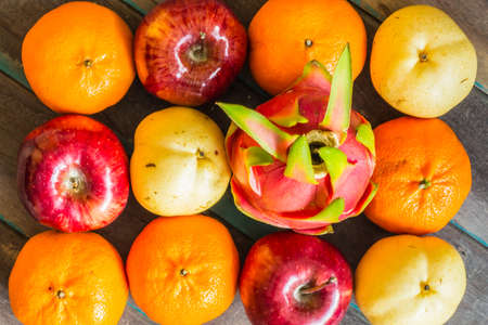 Background colors of many fruits on the woodenの写真素材