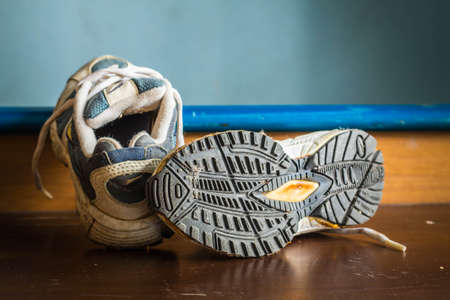 Old sports shoes at a shoe soles.の写真素材