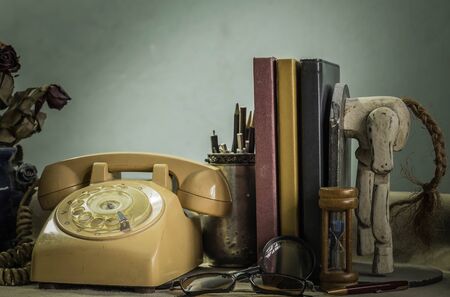 Stationery and books on a desk with a vintage