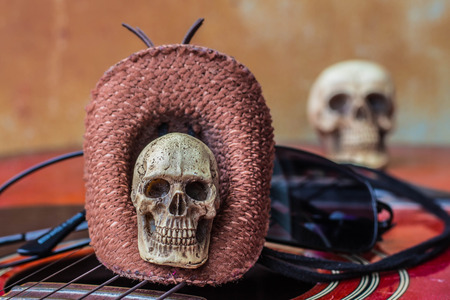 Skull in the Hat on classical guitar background.の写真素材