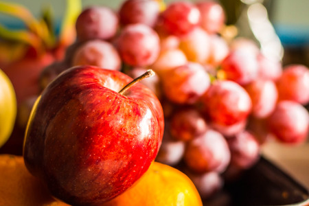 Red apple and other fruits at the market place.の写真素材