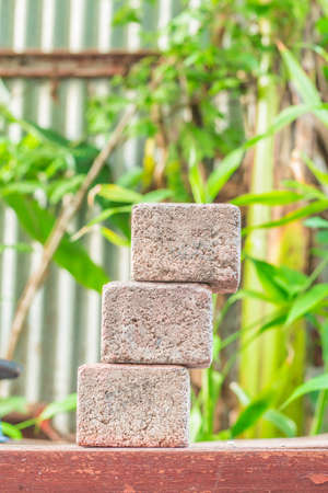 The bricks are stacked on wood.の写真素材