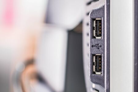 The USB connector of a computer with image blur.